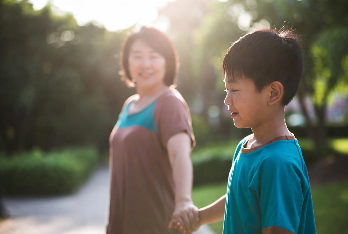 Parent and child walking together
