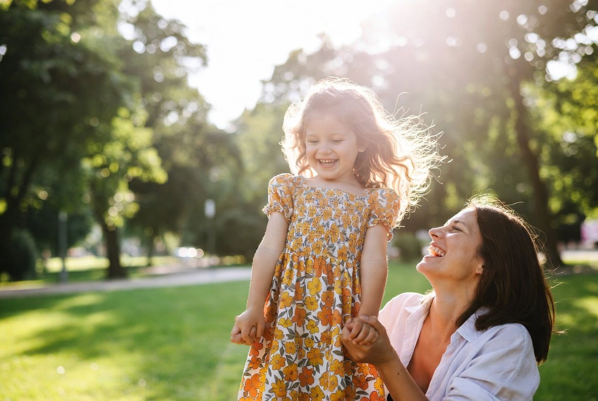 Parent and child sharing a warm embrace in soft golden light